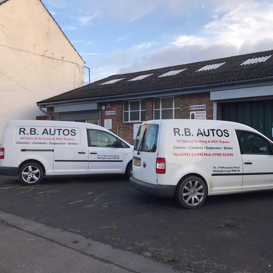 Two white R.B. Autos vans parked outside the garage on Winstanley Road